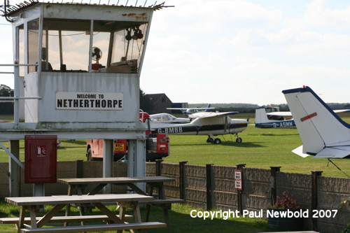 aircraft parked beside the clubhouse